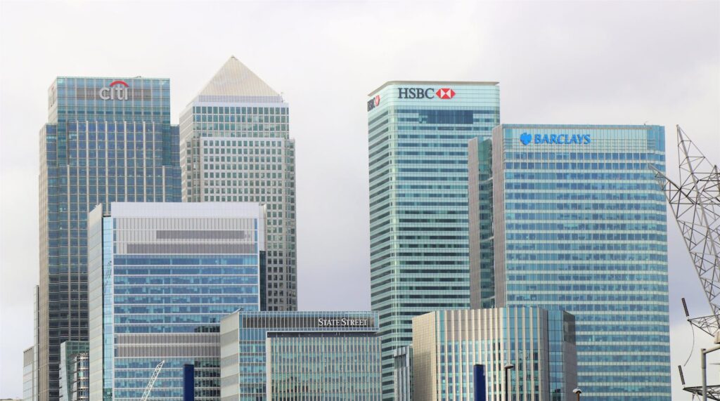 Modern skyline of Canary Wharf featuring iconic bank skyscrapers like HSBC and Barclays for Recommended Banks for Small Business article
