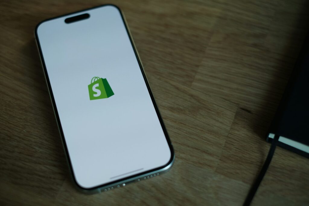 shopify pricing page header image of shopify mobile